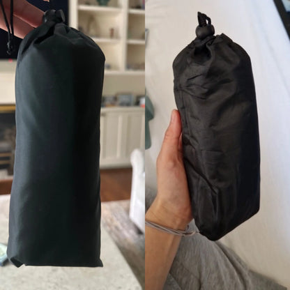 Compact foldable airplane footrest in black travel pouch shown in hand, lightweight and portable for carry-on luggage.